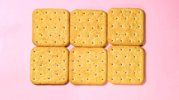 Cookie Cracker Close Een Roze Achtergrond Bovenaanzicht Stockfoto
