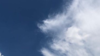 Timelapse of White Cumulus Clouds Changing Shape In Blue Sky.
