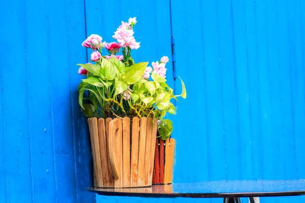 Vintage home arrangement, summer flowers and enamelware on wall