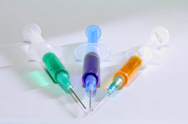 Three syringes on the white background — Stock Photo, Image