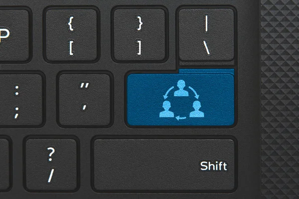 Communication icon on laptop keyboard key. People communicate to each other online