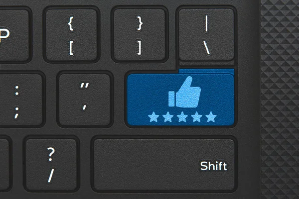 Rating icon on keyboard key. Conceptual idea of 5 star rating and truthness