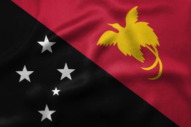 Papua Yeni Gine 'nin ulusal bayrağı kırmızı bir alanda sarı bir Raggiana Cennet Kuşu ve siyah bir alanda Güney Haçı takımyıldızının yer aldığı çapraz bölünmüş durumdadır. Yüksek kalite fotoğraf