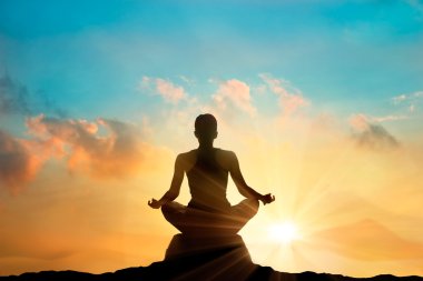 women meditating pastel on high mountain in sunset background clipart
