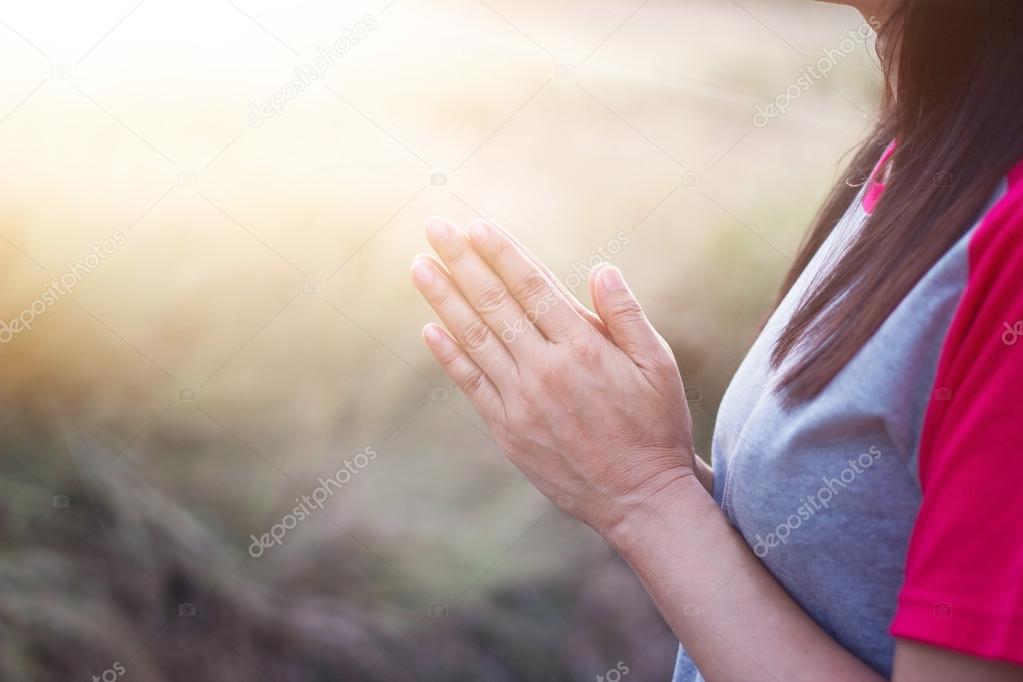 Woman respect and pray on nature background