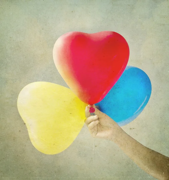 Multi colored balloons toned with a retro vintage — Stock Photo, Image
