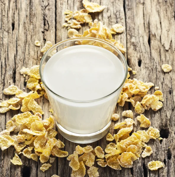 Milk and cornflake on table wooden background — Stock Photo, Image