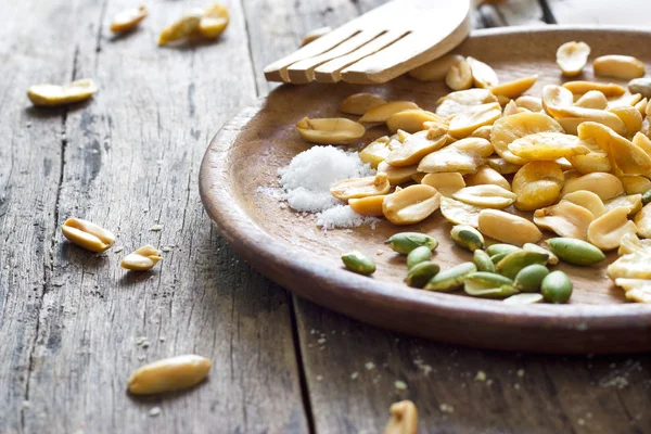 Beans roasted snack, and salty on wood plate — Stock Photo, Image