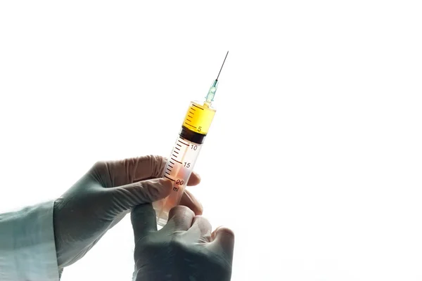 Syringe in hand grove vibrant on white background, blank text — Stock Photo, Image