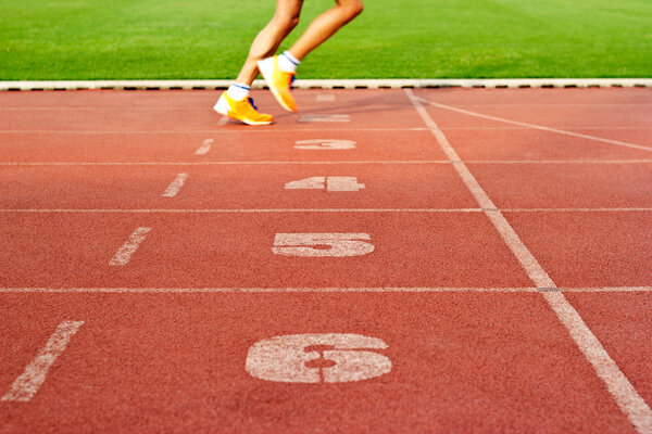 lanes number, track and athlete running on  lanes number