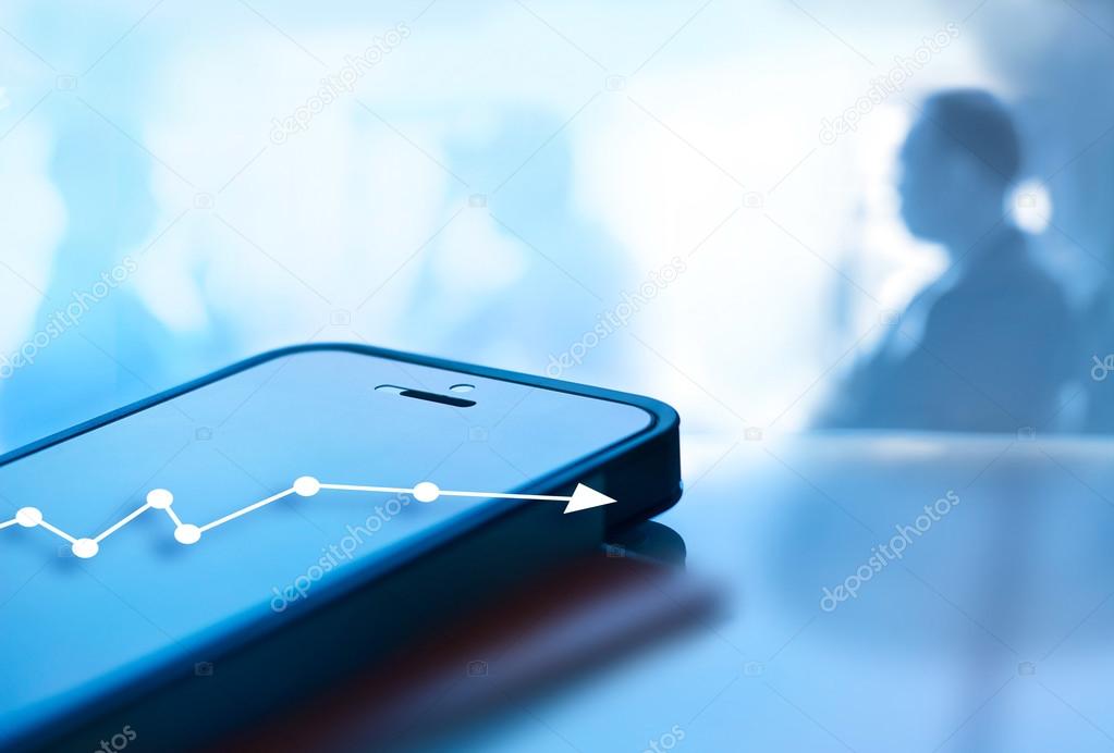 Abstract mobile phone and graph chart growth on screen
