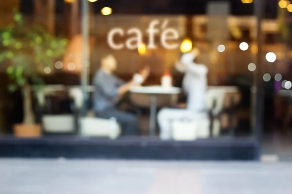Abstract people in coffee shop and text cafe in front of mirror — Stock Photo, Image