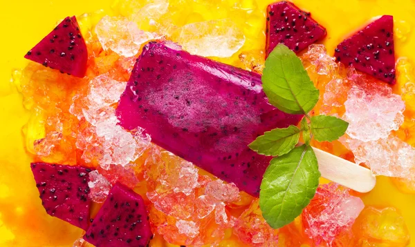 Homemade frozen popsicles made with Dragon fruit on ice background — Stock Photo, Image