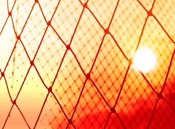 Wibrujący streszczenie piłki nożnej gola na tle zachodu słońca — Zdjęcie stockowe