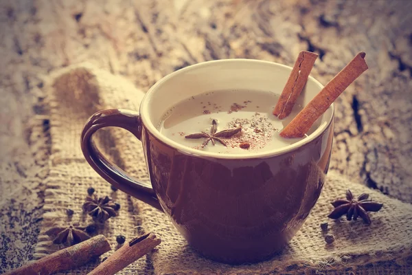 Masala chai tea with spices and star Anise, cinnamon stick, peppercorns on sack — Stock Photo, Image