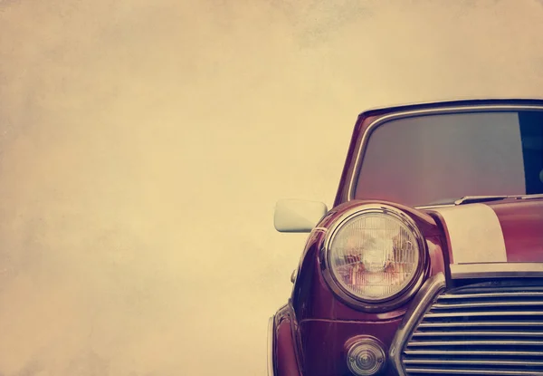 Luz de cabeza de coche retro sobre fondo de grano de papel, tono de color vintage — Foto de Stock