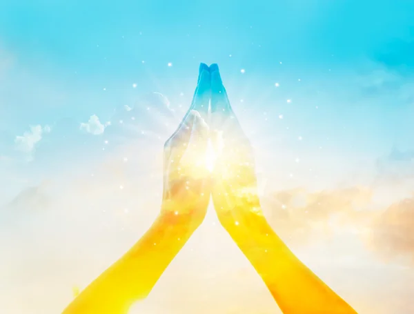 Abstract colorful hands respect and pray on sky background — Stock Photo, Image