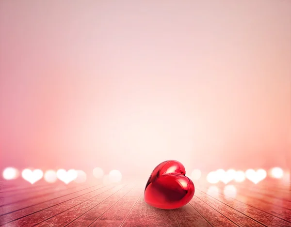 Red heart and bokeh on wooden floor vibrant for background, soft focus — Stock Photo, Image