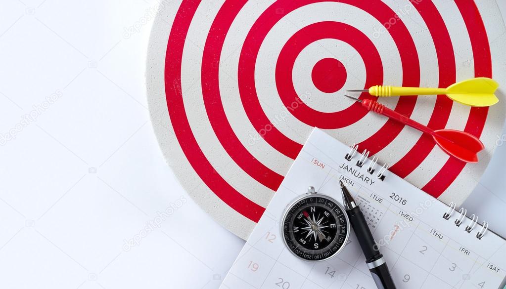 Sheet of a calendar with pen and compass, Red target with red and yeiiow darts