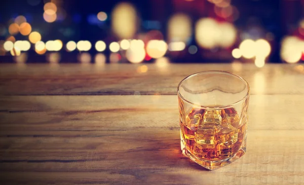 Whiskey drink on wood background — Stok Foto