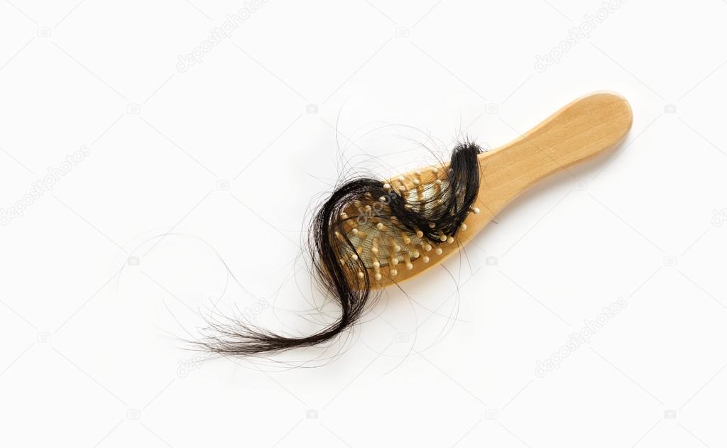 woman losing hair in hairbrush on white background, blank text