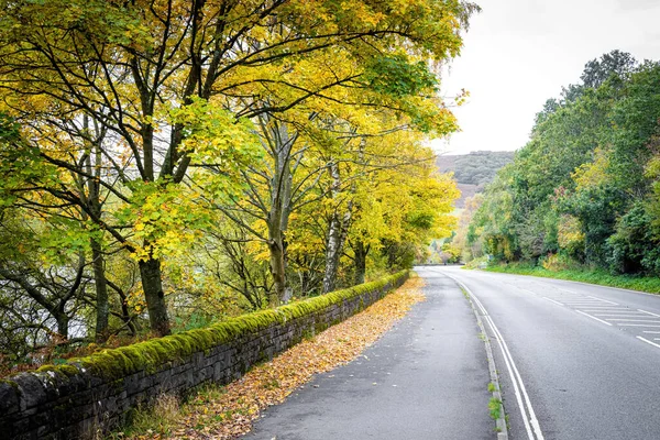 A road in Peak district, an upland area in England at the southern end of the Pennines, UK