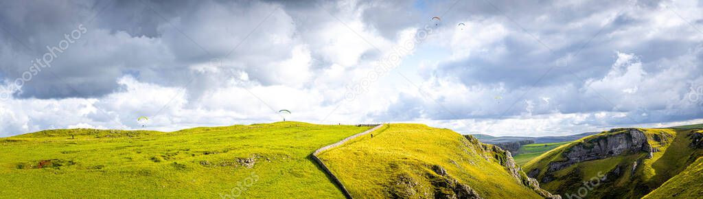 Paragliding in Peak district, an upland area in England at the southern end of the Pennines, UK