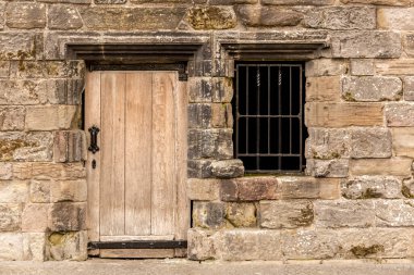 Old vintage door of stone building in Scotland, UK