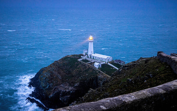 A lighthouse on South Stack, an island situated just off Holy Island on the northwest coast of Anglesey in Wales, UK