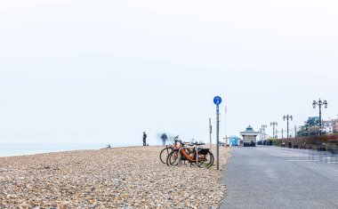 A view of the high tide and tidal poles at the seaside, Worthing, UK