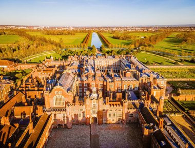 The aerial view of Hampton Court Palace, a royal palace in the London Borough of Richmond upon Thames, UK clipart