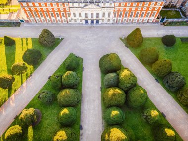The aerial view of Hampton Court Palace, a royal palace in the London Borough of Richmond upon Thames, UK