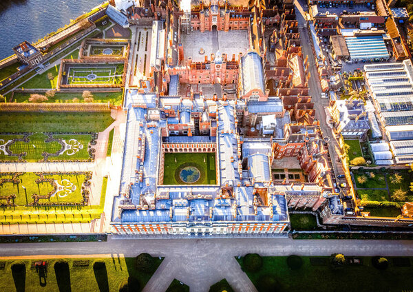 The aerial view of Hampton Court Palace, a royal palace in the London Borough of Richmond upon Thames, UK