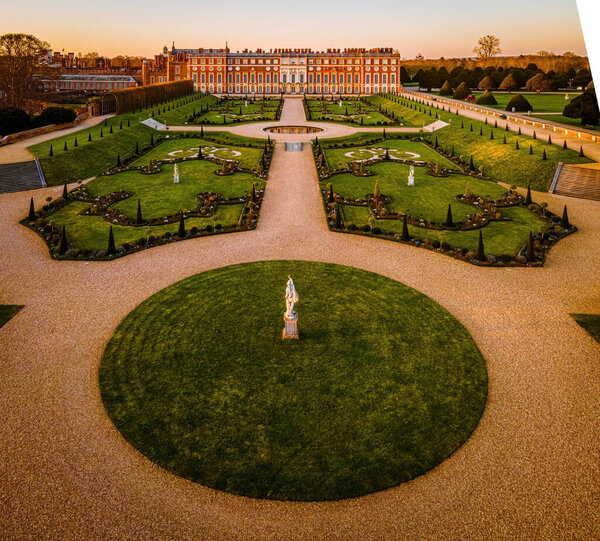 The aerial view of Hampton Court Palace, a royal palace in the London Borough of Richmond upon Thames, UK