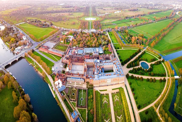 The aerial view of Hampton Court Palace, a royal palace in the London Borough of Richmond upon Thames, UK