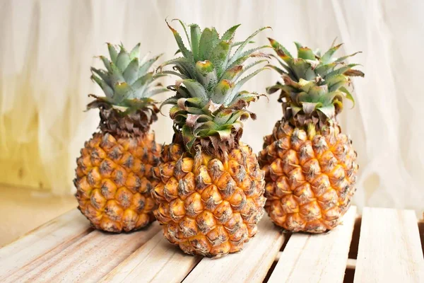 Two orange pineapples isolated in white background, no shadow, fresh tropical fruit background, summer, holiday, food and beverage, juicy, cool, vegan, healthy food, fitness