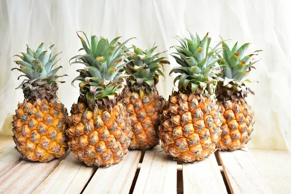 Two orange pineapples isolated in white background, no shadow, fresh tropical fruit background, summer, holiday, food and beverage, juicy, cool, vegan, healthy food, fitness