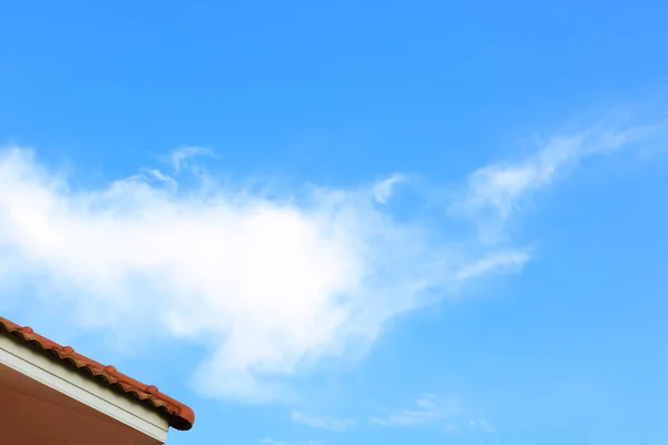 blue sky picture with roof and cloudy