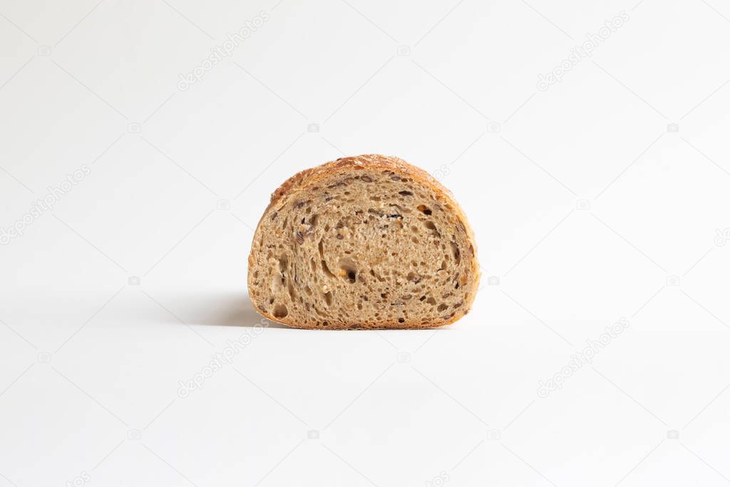 Unleavened chrono bread with seeds on a white background