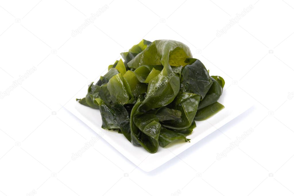 Seaweed on white dish isolated on white background. Japanese food
