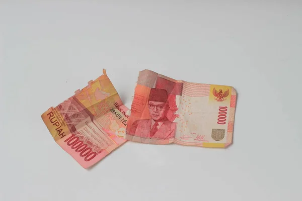 Conceptual Photo Rupiah Paper Money Torn Broken 100000 Top View — 스톡 사진