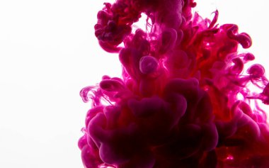 Mürekkep suya düşer. Soyut arkaplan. Pembe arkaplan.