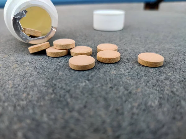 Closeup Pill Bottle Orange Pills Stone Background Selective Focus — Stock Photo, Image