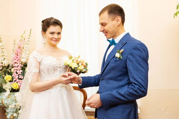 the newlyweds sign the marriage certificate, the lovers fill out the marriage contract, the family legal document at the wedding