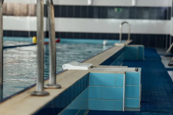 handrails for leaving the pool. cool and clean water in the swimming pool for relaxation and sports training