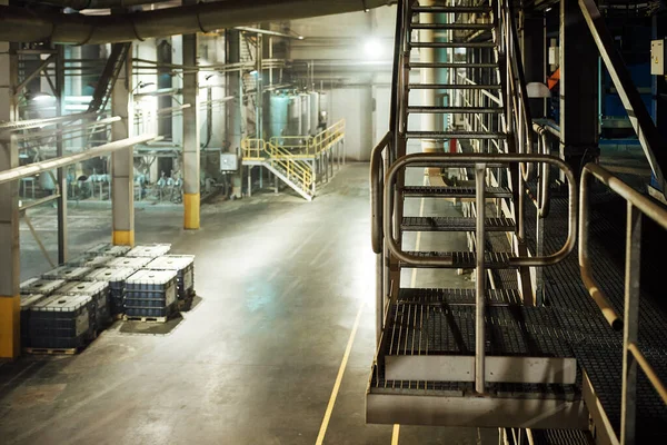 railing of the factory shop. fences for the safety of employees at work. industrial landscape of the factory interior