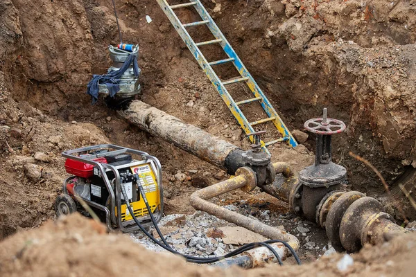 emergency services, the repair team provides safety during the replacement of pipes, old communications are changed to new ones, the gas pipeline, the old and rusted water pipe with dirty gates