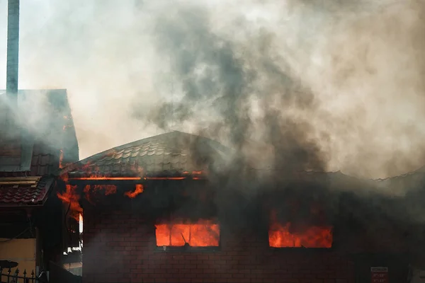 the fire destroys the building. the fire brigade pours water on the burning house. people are suffocating from the smoke and smog from the fire. fire victims