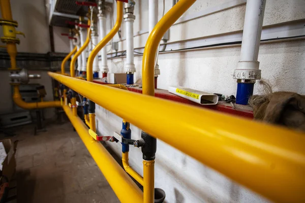 stock image the gas pipeline at the plant. yellow pipeline for the transportation of energy raw materials under pressure. the network of communication pipes at the processing enterprise