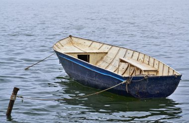 Small boat in the lake clipart